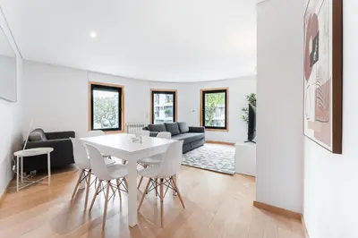 a living room with a white table and chairs at GuestReady - Artsy Apartment in Porto