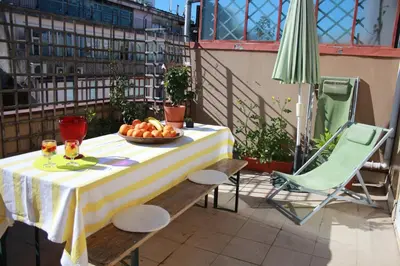 a table with a bowl of fruit on a balcony at Pretty flat with terrace, air cond, free parking, by Porto with Love LDA in Porto