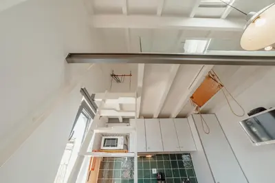 a view from the top of the stairs in a tiny house at Mezzanine Stylish Apartments by Vacationy in Porto