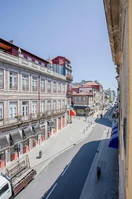 an empty street in a city with buildings at Liiiving in Porto - Aliados Stone Apartment in Porto