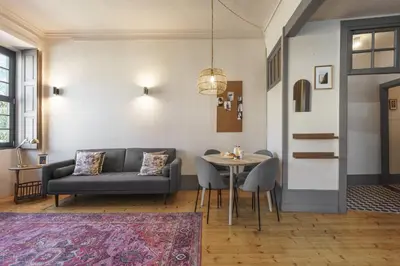 a living room with a couch and a table at Feel Porto Antique Poveiros Flats in Porto