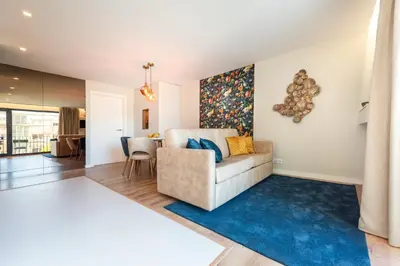 a living room with a couch and a table at Paraíso Apartment in Porto