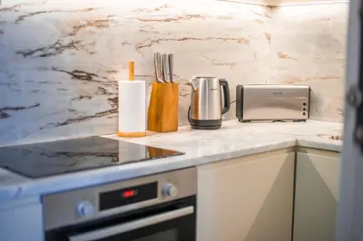 a kitchen with a counter top with a appliance on it at Paraíso Garden Suite--- Spacious & Downtown in Porto