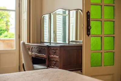 a dresser with a mirror on top of it at Paraíso Garden Suite--- Spacious & Downtown in Porto