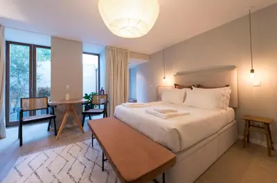 a bedroom with a white bed with three pillows at Porto Central Loft I with Terrace in Porto