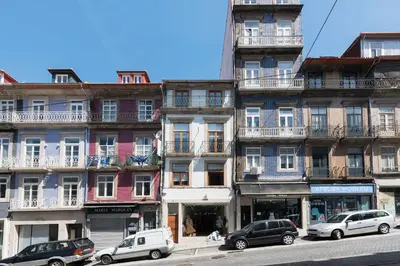 a courtyard with a table and chairs in a building at Porto Central Loft I with Terrace in Porto