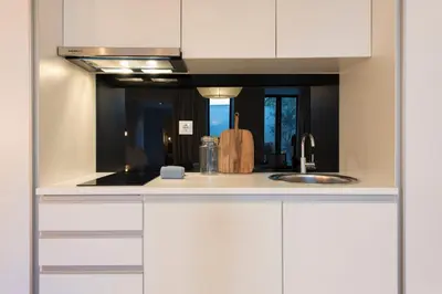 a room with a bed and a table and a tv at Porto Central Loft I with Terrace in Porto