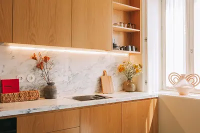 a kitchen counter with a sink and a window at Village By BOA in Porto