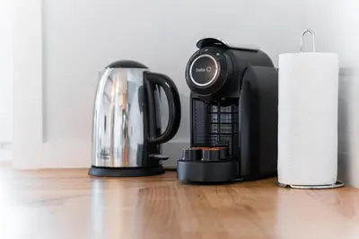 a coffee maker and a paper roll on a floor at GuestReady - Urban Retreat in Gaia in Vila Nova de Gaia