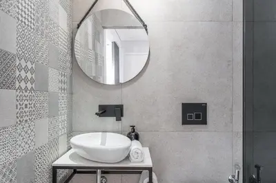 a bathroom with a sink and a mirror at GuestReady - Urban Retreat in Gaia in Vila Nova de Gaia