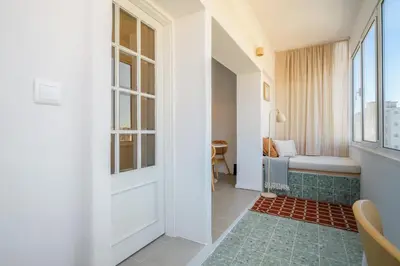 a hallway with a door and a window at Santa Catarina Panoramic Loft in Porto