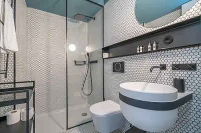 a bathroom with a toilet and a sink and a shower at Infante Apartment by Amber Star Rent in Porto