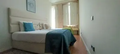 two beds sitting next to each other in a bedroom at Art City Villa in Porto