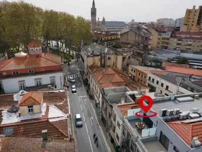 a car is parked in a garage on a street at Art City Villa in Porto
