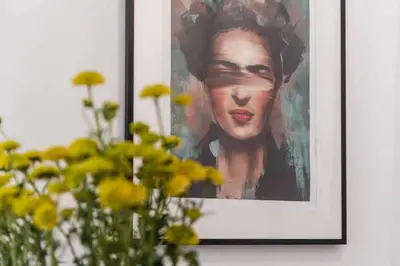 a picture of a woman in a painting on a wall at Classic Bonjardim in Porto