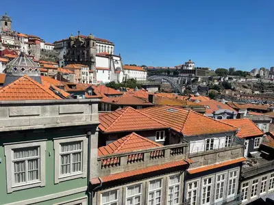 a group of buildings with red roofs at Porto Republica Ribeira in Porto