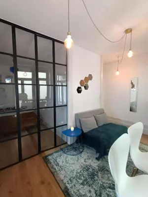 a living room with a couch and a table at Pateo Loft in Porto