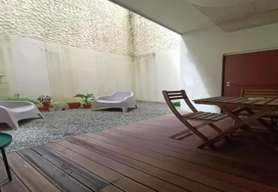 a room with chairs and a table and a table and chairs at Pateo Loft in Porto
