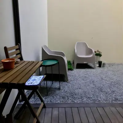 a room with two chairs and a wooden table at Pateo Loft in Porto