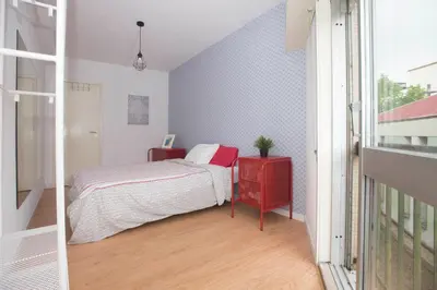 a kitchen and dining room with a table and a couch at Travel & Live Marques in Porto