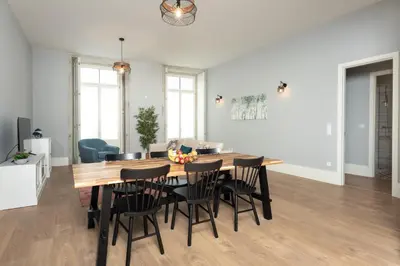 a dining room with a table and chairs at Porto XL in Porto