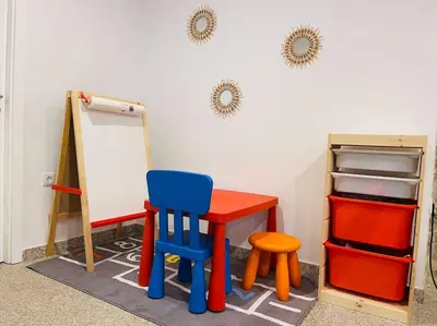 a room with a desk and a chair and a chalkboard at Apartamento central, junto a Praça da Batalha - APT F in Porto