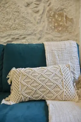 a pillow sitting on top of a blue couch at Apartamento central, junto a Praça da Batalha - APT F in Porto