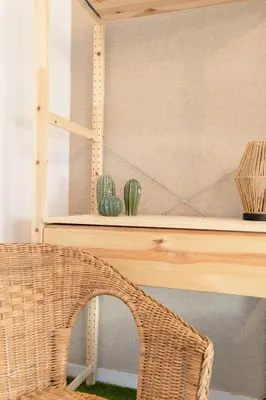 a wicker chair in front of a desk with a cactus at Travel & Live Nature in Porto