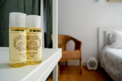 two bottles of essential oils sitting on a table at Travel & Live Nature in Porto