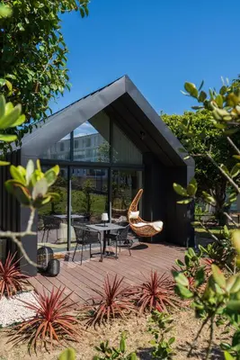 a house with a patio with a table and chairs at FONTE SANTA Manor House in Vila Nova de Gaia