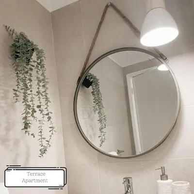 a bathroom with a mirror and a sink at Manuel Apartment - Porto Velho Apt in Porto