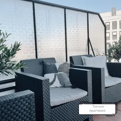 a balcony with two wicker chairs and pillows at Manuel Apartment - Porto Velho Apt in Porto