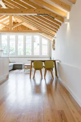 a dining room with a table and two chairs at ORM Prado Apartment in Porto
