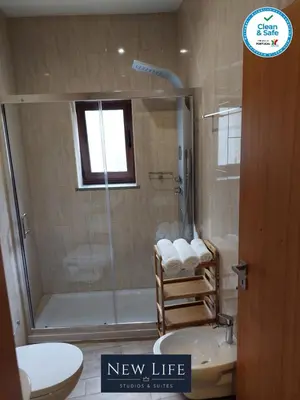 a bathroom with a shower and a toilet and a sink at New Life - SÉ CATEDRAL STUDIO - 1T in Porto