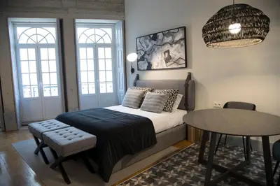 a bedroom with a bed and a table and chairs at TOP Porto in Porto