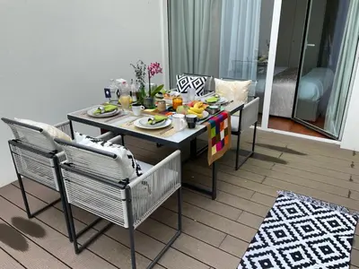 a dining table and chairs with food on it at Luxury in the Art District by Innkeeper in Porto
