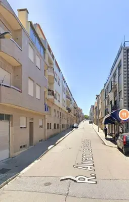an empty street with buildings on the side of the road at Porto Central Home in Porto