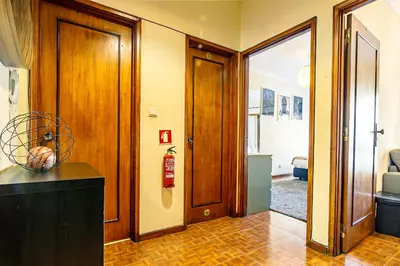 a hallway with a door leading to a room at Porto Central Home in Porto
