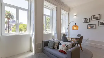 a living room with a couch and a table at OPOrto Downtown Studio by LovelyStay in Porto