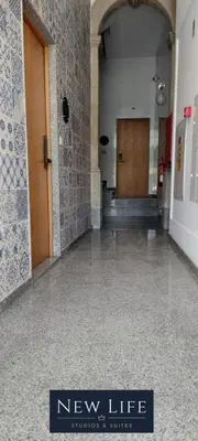 a hallway with a new life sign in a building at New Life - PALÁCIO CRISTAL STUDIO-3F in Porto