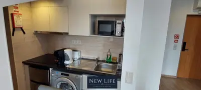 a kitchen with a sink and a washing machine at New Life - PALÁCIO CRISTAL STUDIO-3F in Porto