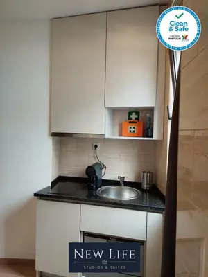 a kitchen with a new life sign next to a sink at New Life - PARQUE CIDADE STUDIO-0T in Porto