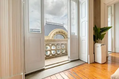 an open door with a view of a building at GuestReady - Bolhão Market Place in Porto