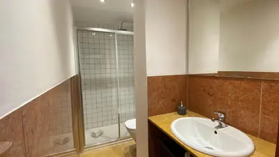 a bathroom with a sink and a toilet at BEST - Studio Porto Downtown with AC and Parking in Porto