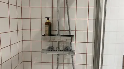 a bathroom with a shelf in the corner of a shower at BEST - Studio Porto Downtown with AC and Parking in Porto