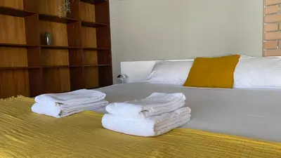 a room with a bed with towels on it at BEST - Studio Porto Downtown with AC and Parking in Porto