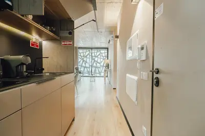 a corridor of a building with a glass door at City Center Premium Apartment by Vacationy in Porto
