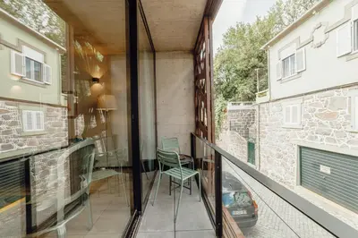 a dining room with a table and chairs at City Center Premium Apartment by Vacationy in Porto