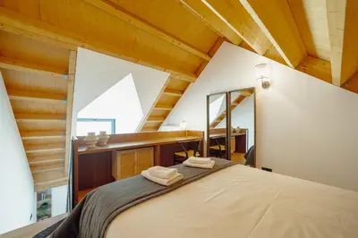 a bedroom with a large bed and a mirror at Elegant Downtown Apartment by Vacationy in Porto