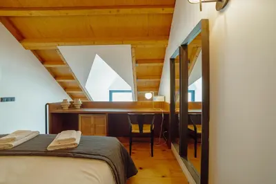 a bedroom with a desk and a bed in a room at Elegant Downtown Apartment by Vacationy in Porto